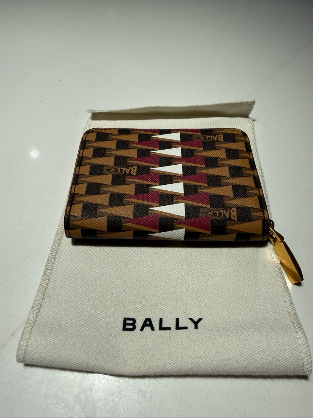Small zippered card wallet on Bally pouch